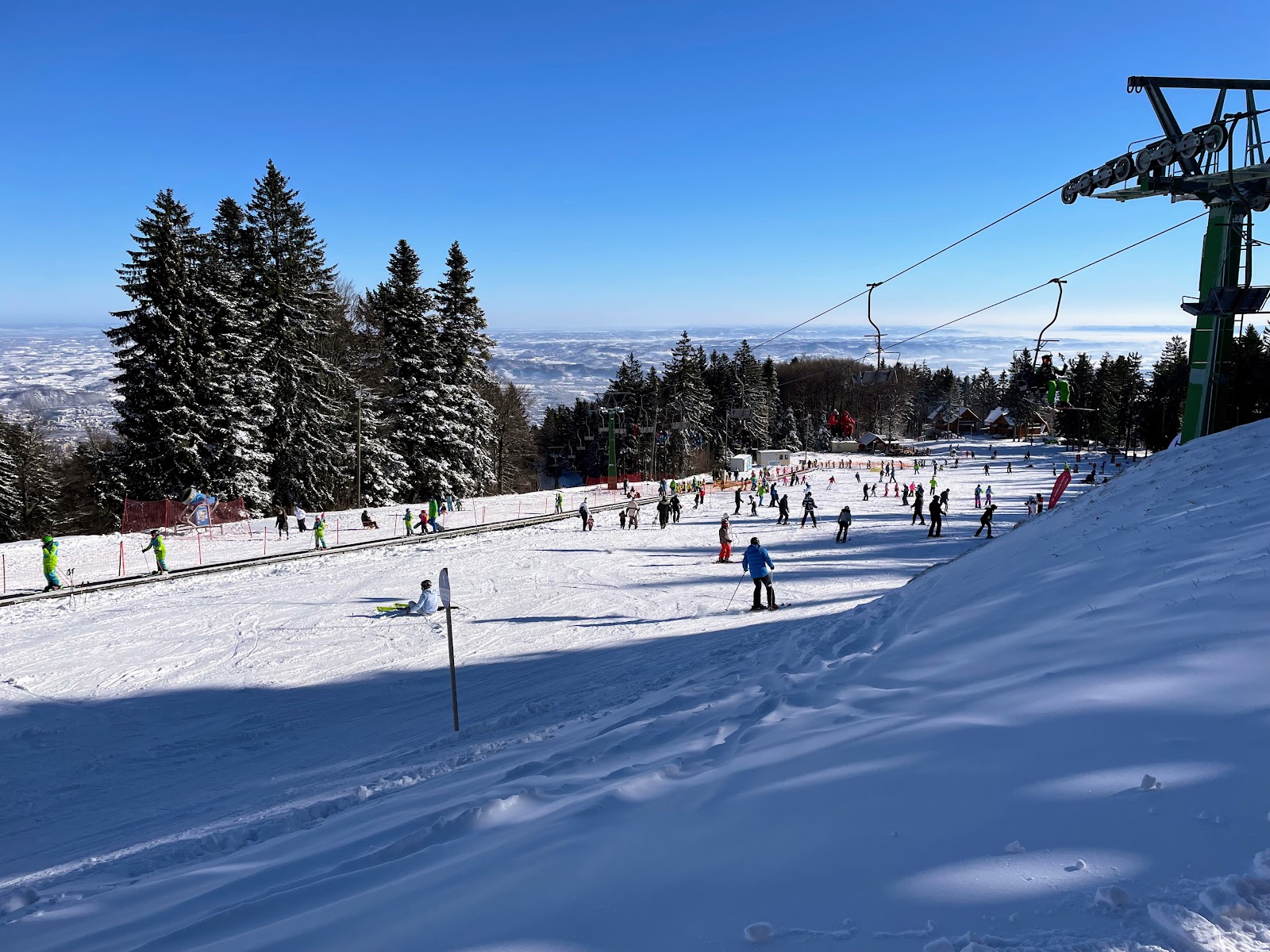 Gondola and chairlifts rising from the city into the Pohorje ski area