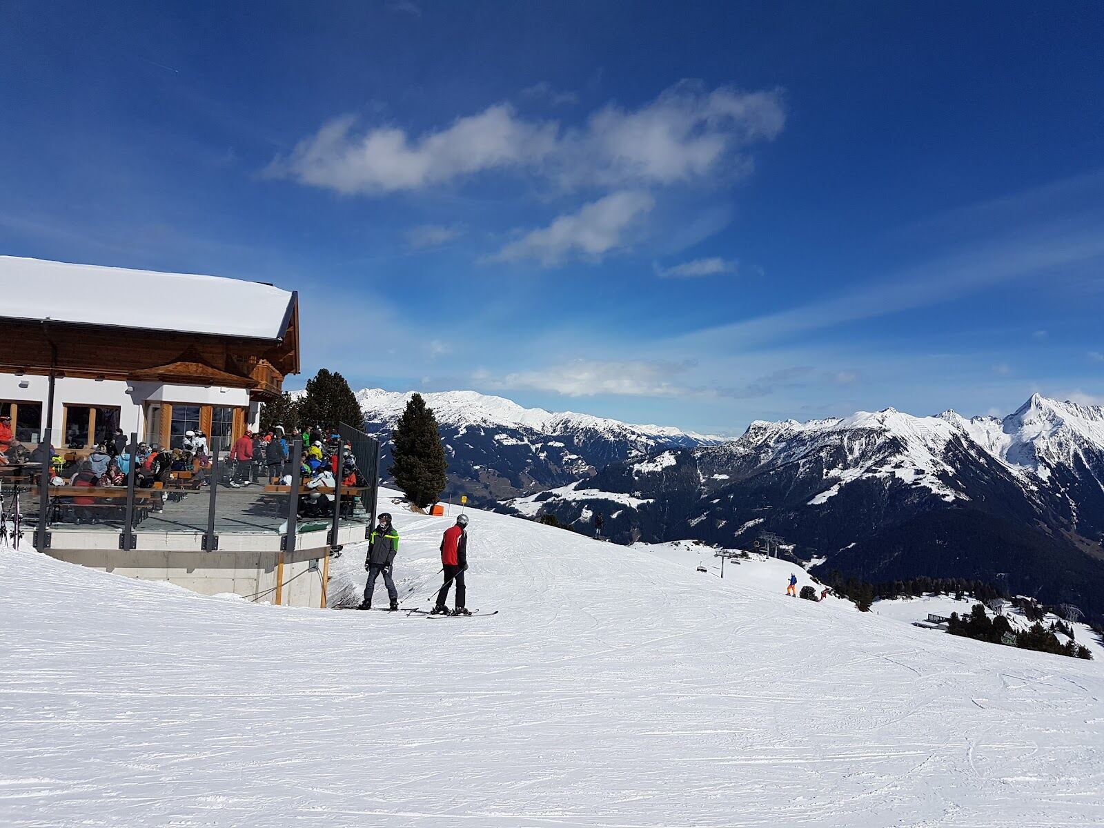 A broad groomed blue piste on the Penken above Mayrhofen in sunshine