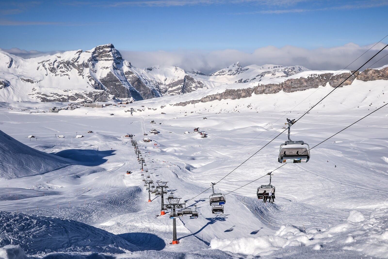 The frozen Melchsee lake surrounded by snow and mountains