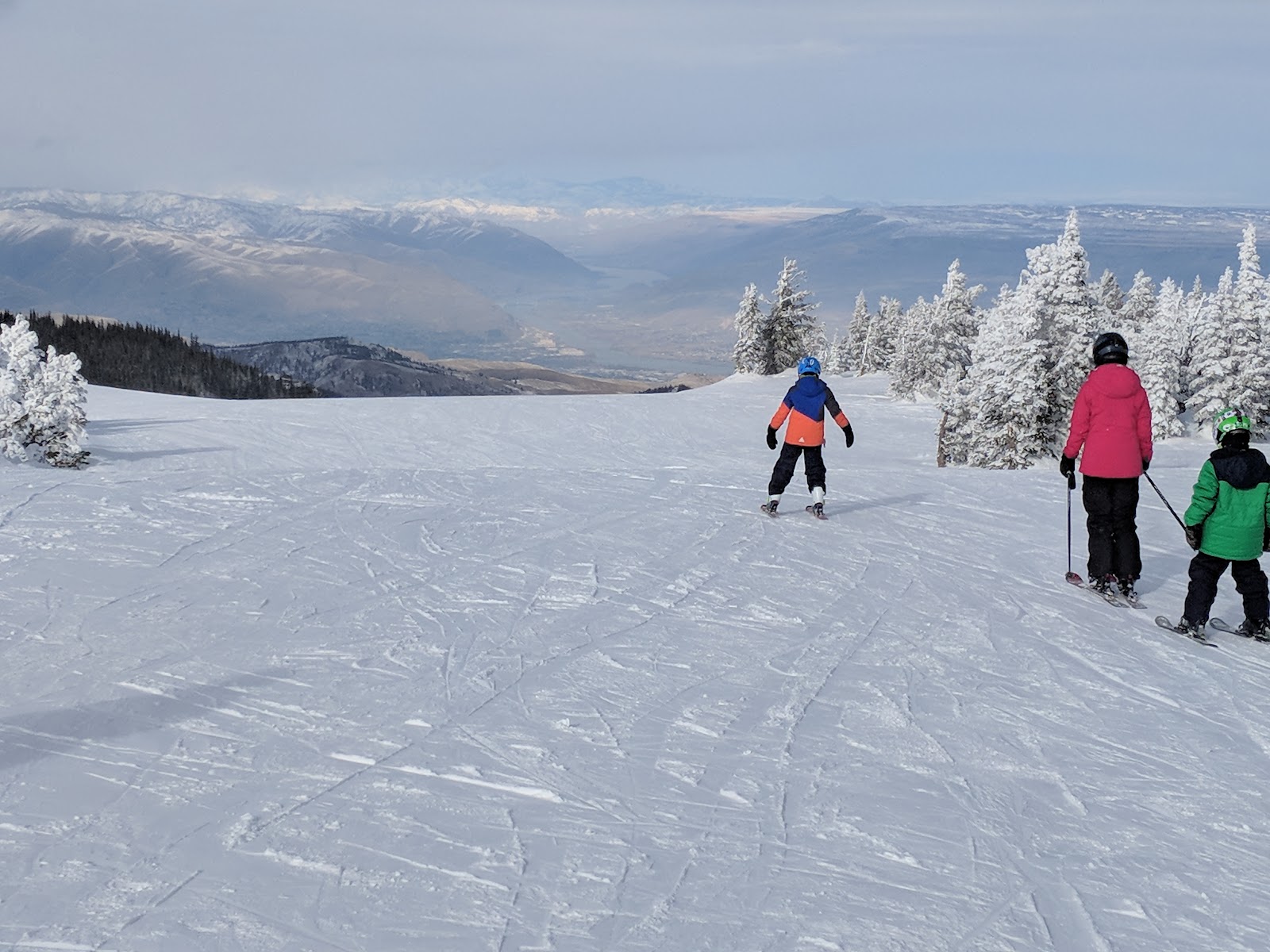 Chairlift climbing the quiet ridge with views over central Washington