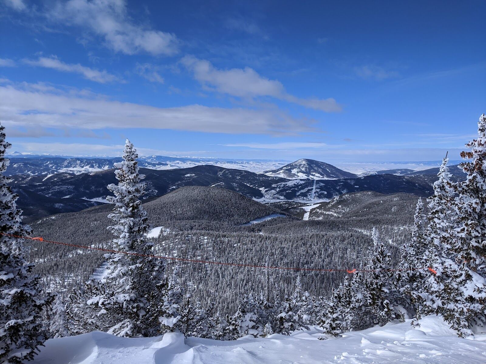 Uncrowded snowy slopes at Monarch Mountain on a clear day