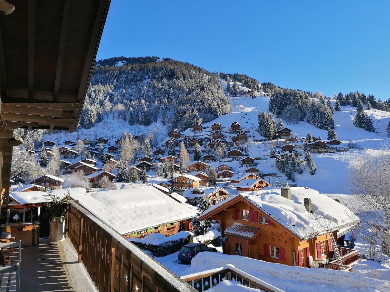 Skiers on wide easy slopes in the Portes du Soleil above Morgins