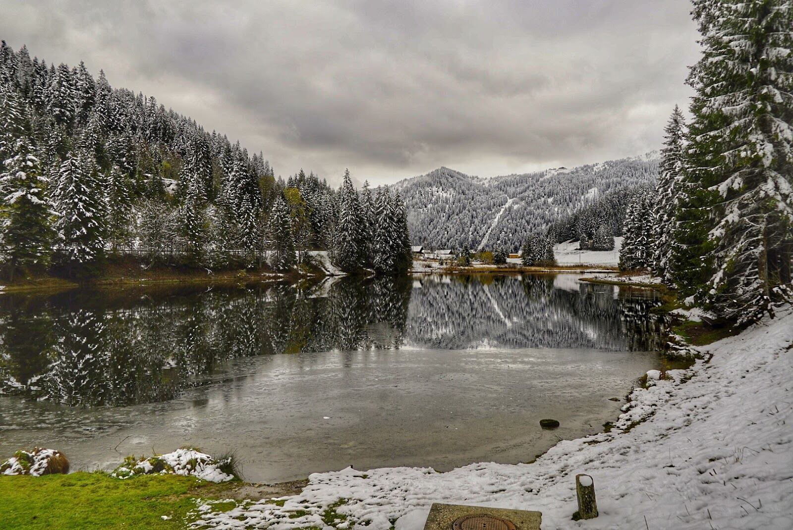 Snowy chalets and church in the center of Morgins