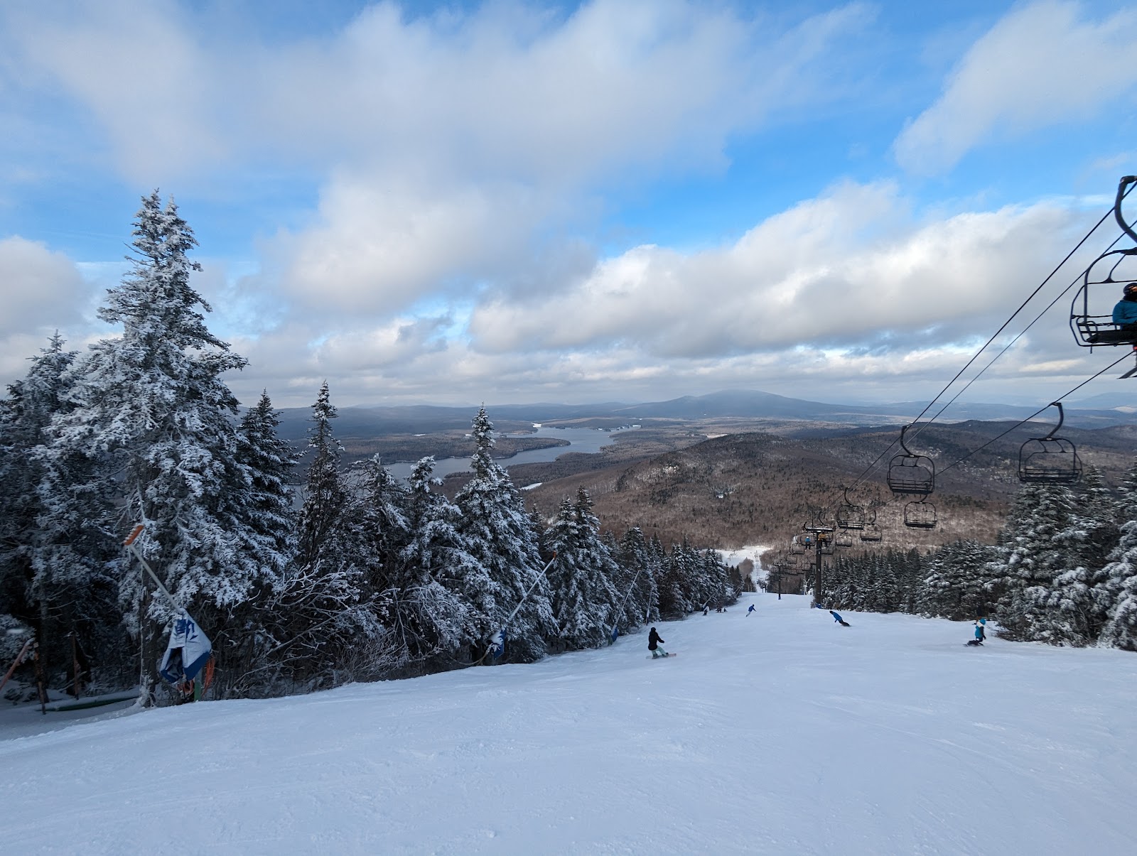 Skiers riding a chairlift at Mount Snow in southern Vermont