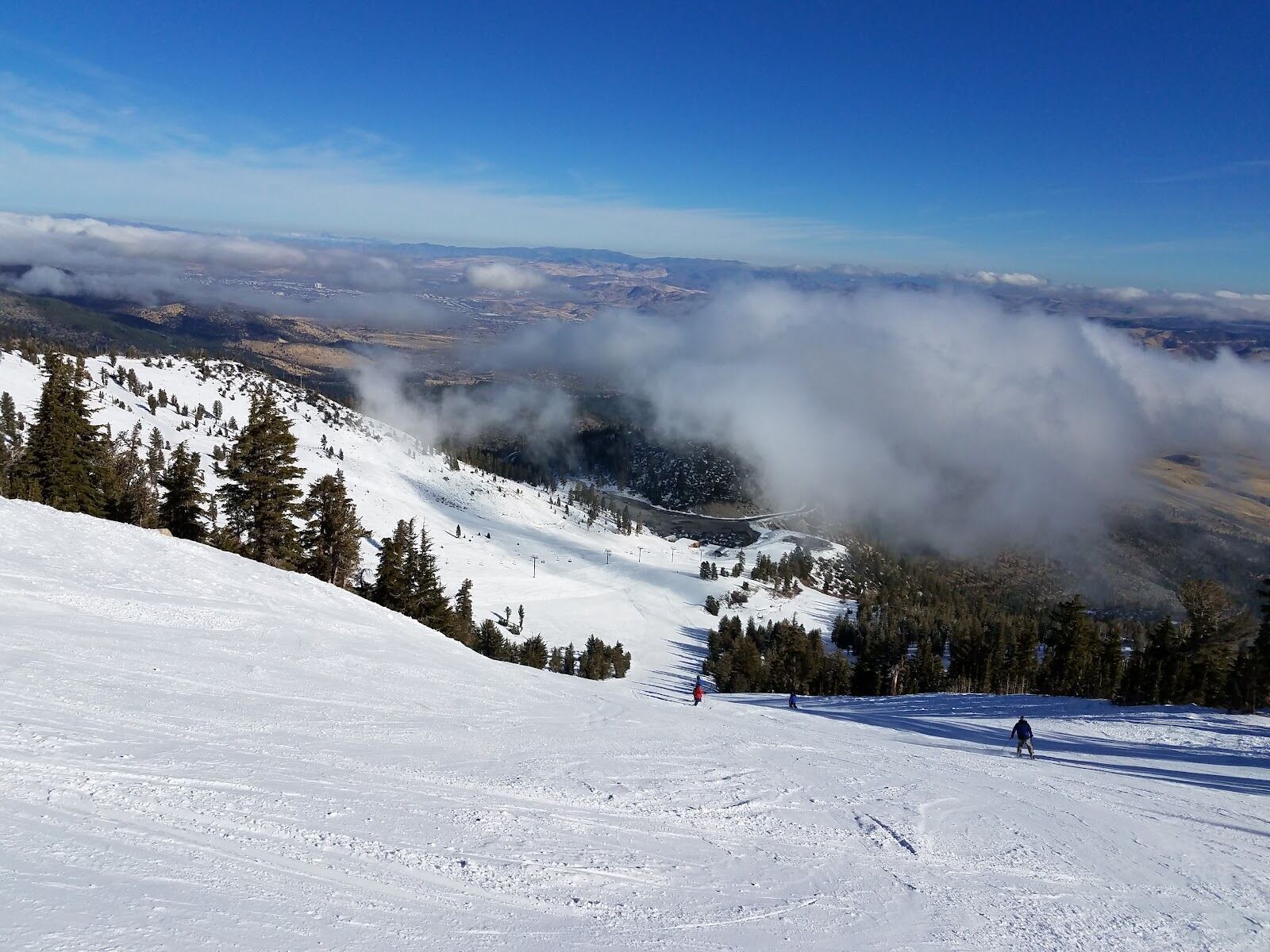 Skier dropping into the steep Chutes at Mt Rose Ski Tahoe