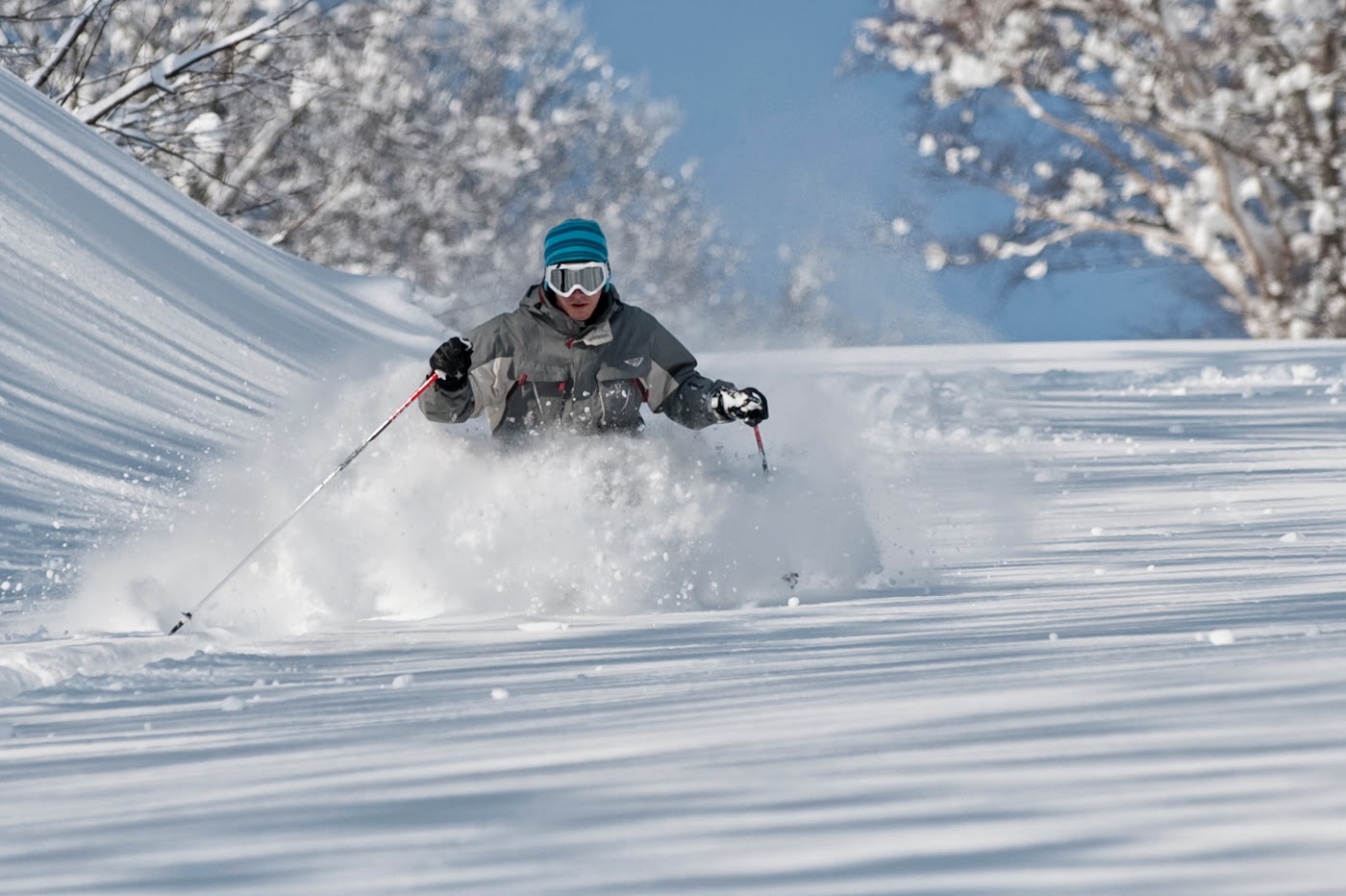 A chairlift rising over heavy snowfall at a Myoko resort
