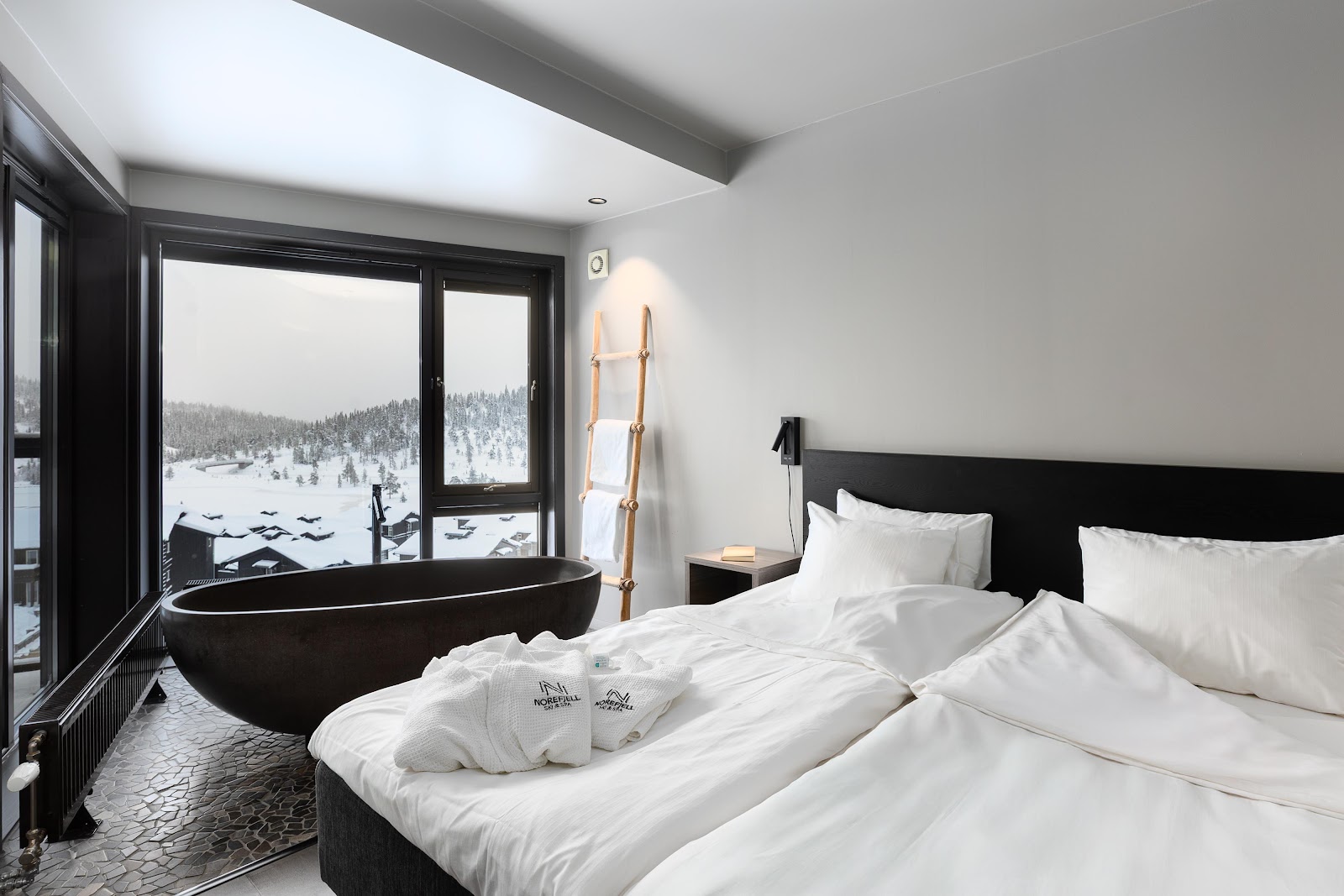 Snowy hillside and lake views at Norefjell near Oslo
