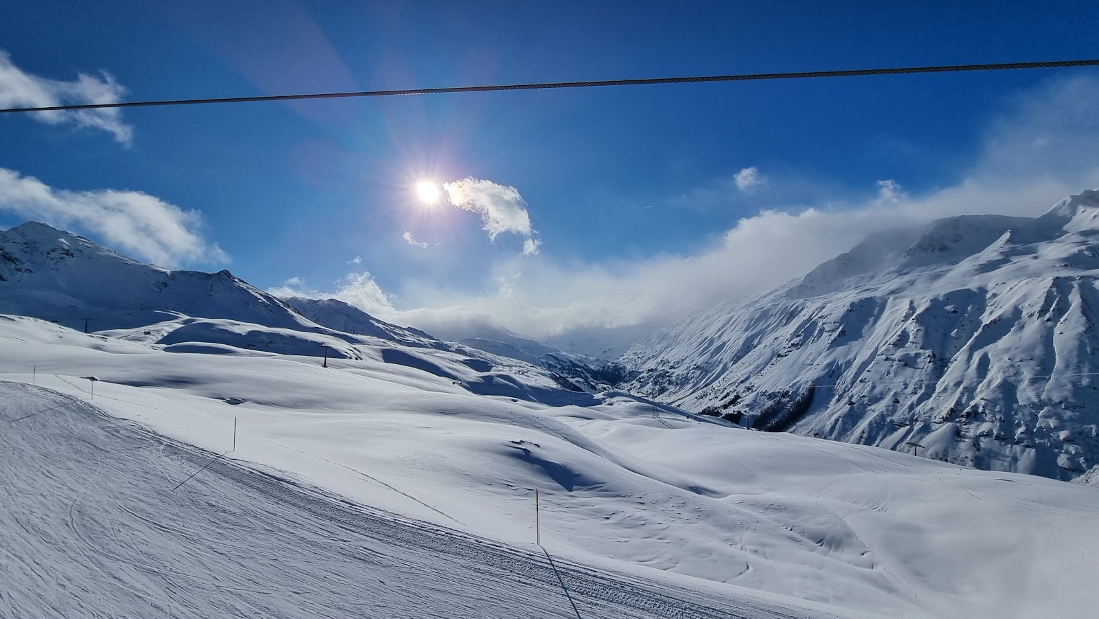 A family of skiers on a gentle snow sure slope at Obergurgl