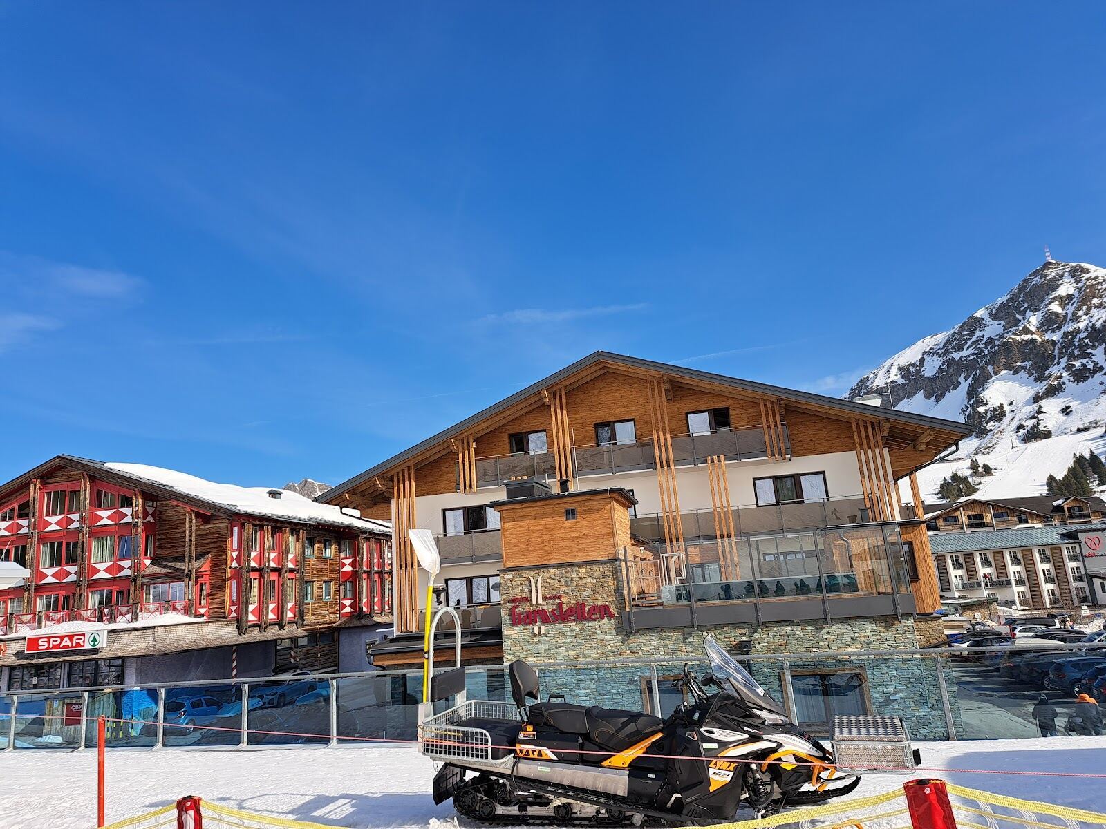 A busy apres ski bar terrace at the base of the slopes in Obertauern