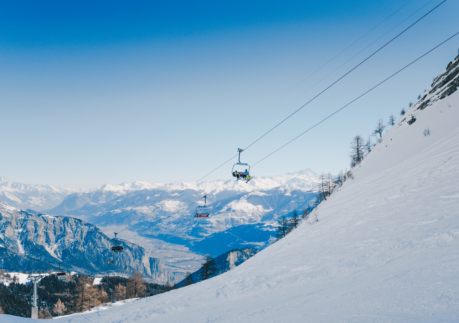 The sunny balcony village of Ovronnaz above the Rhone valley in winter