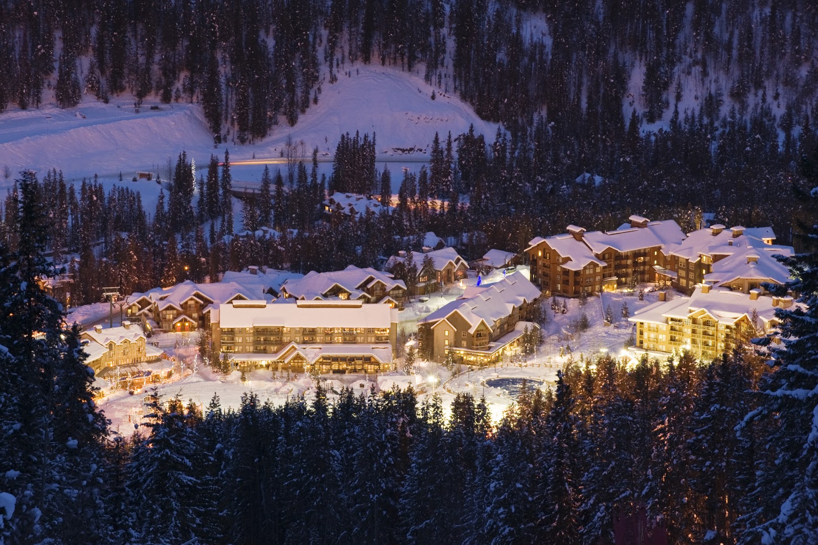 Steaming outdoor hot pools at the base village of Panorama in winter