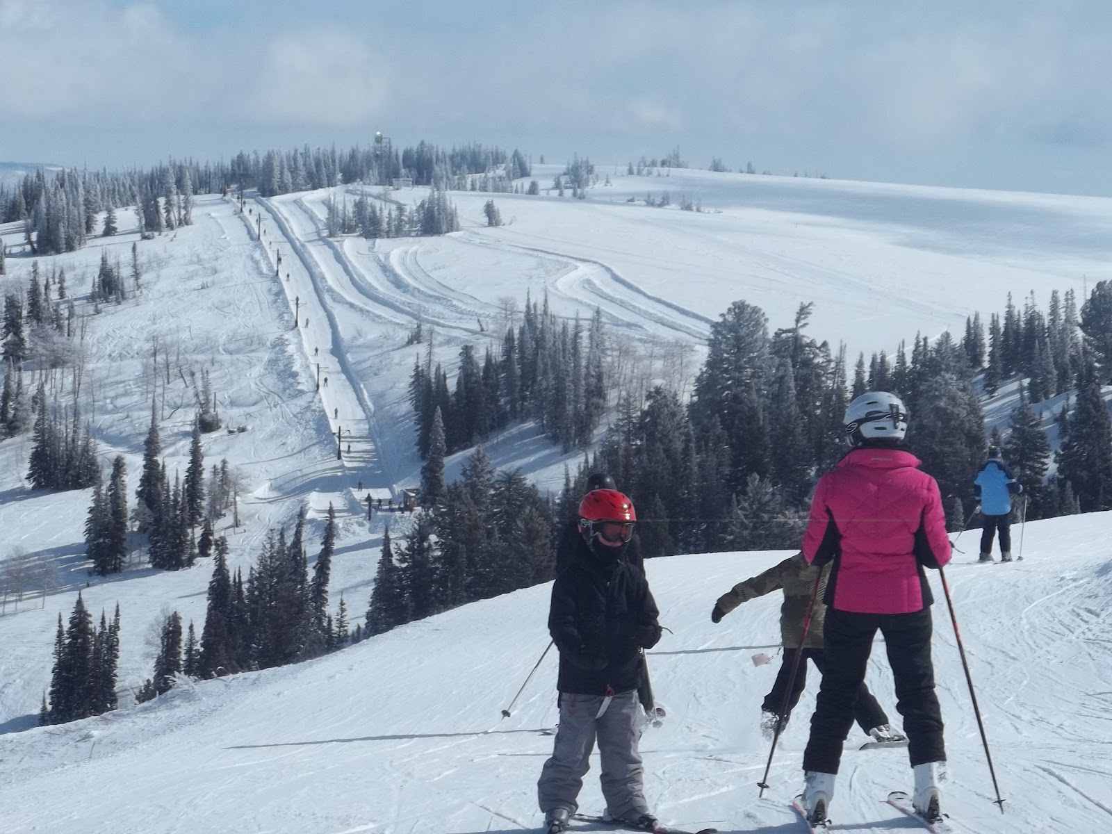 A skier making fresh tracks on a quiet slope at Powder Mountain