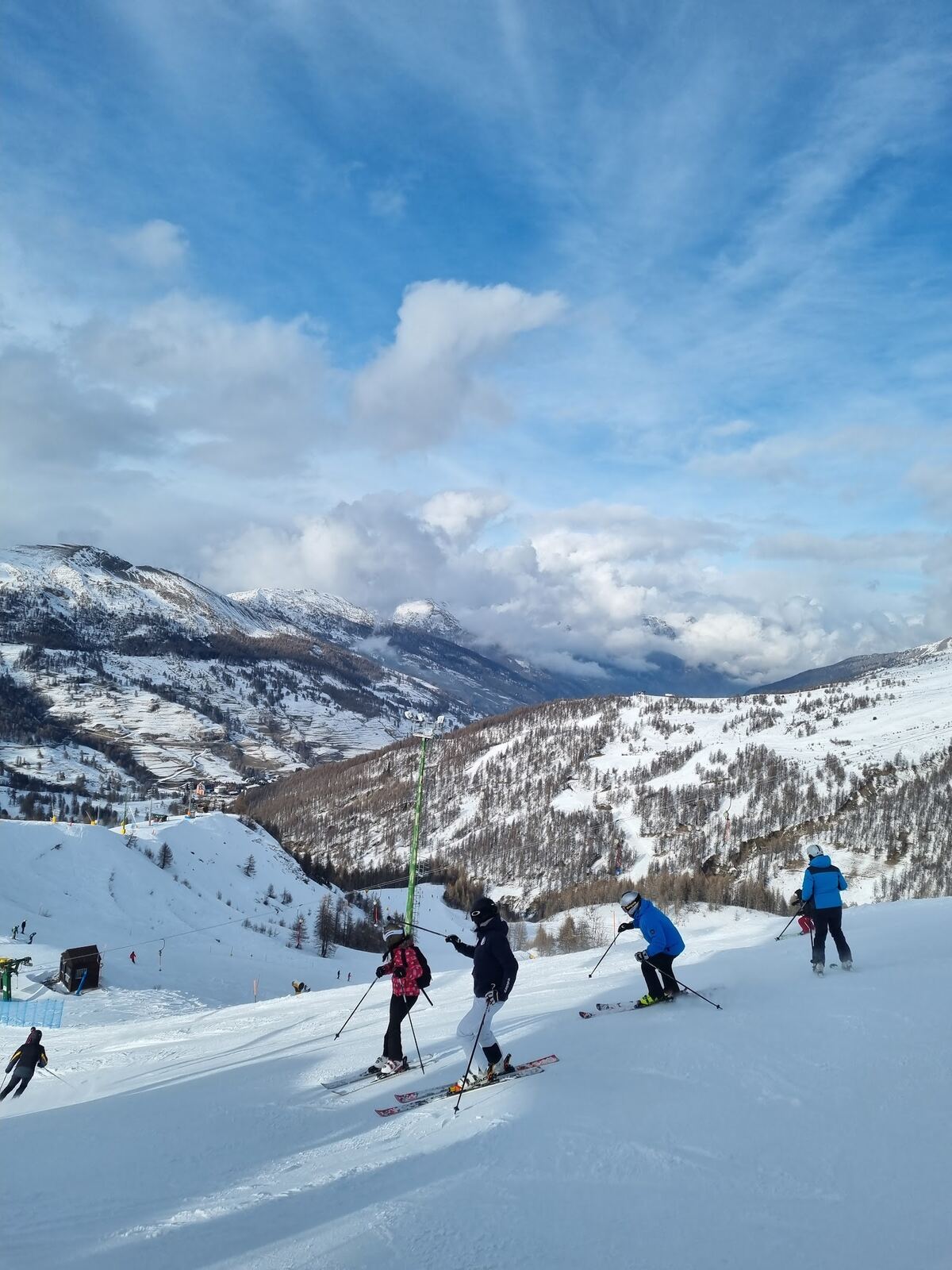 Snow covered old stone hamlets of Pragelato beneath the peaks