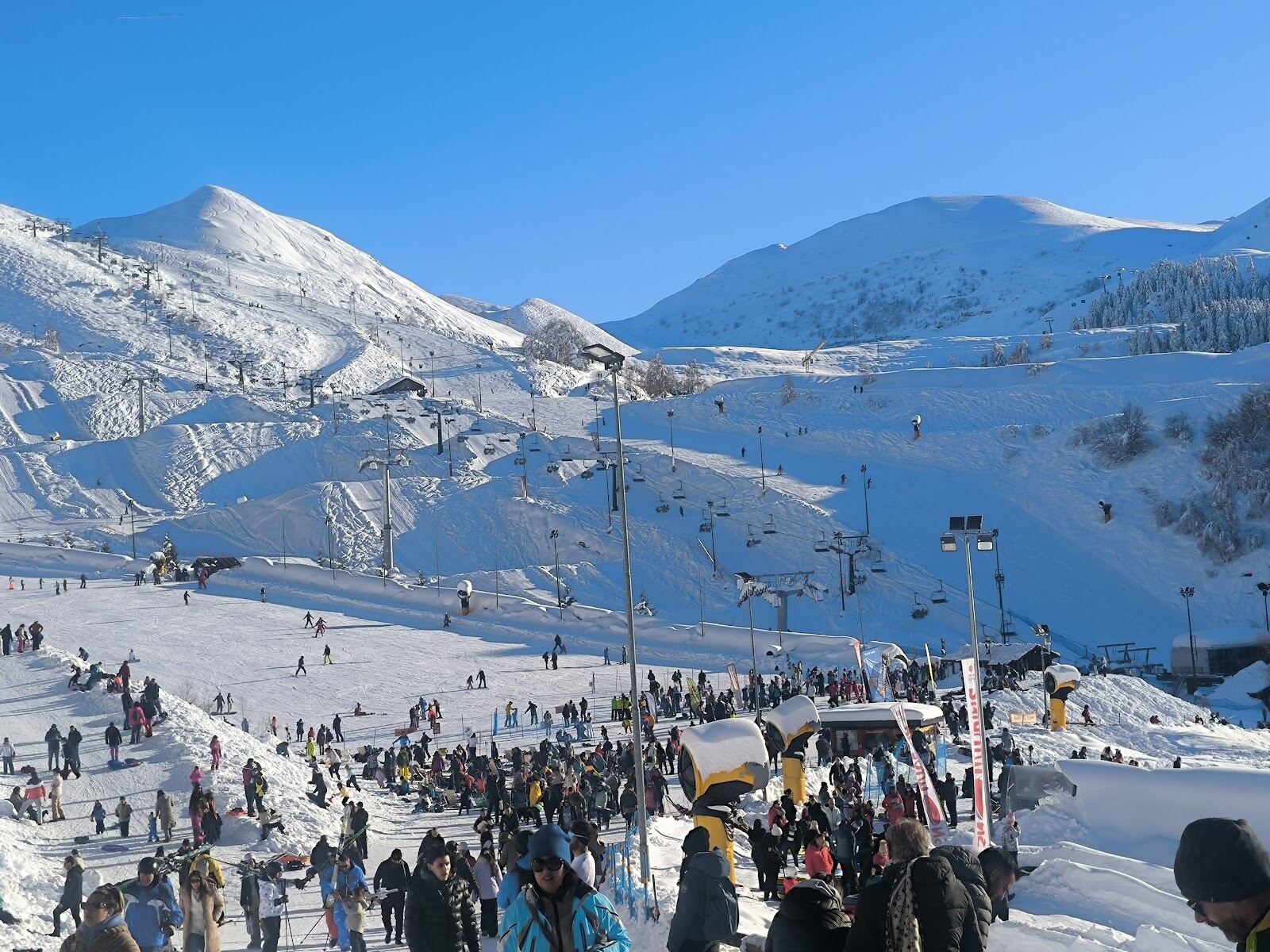 A chairlift over the sunny Mondole area pistes