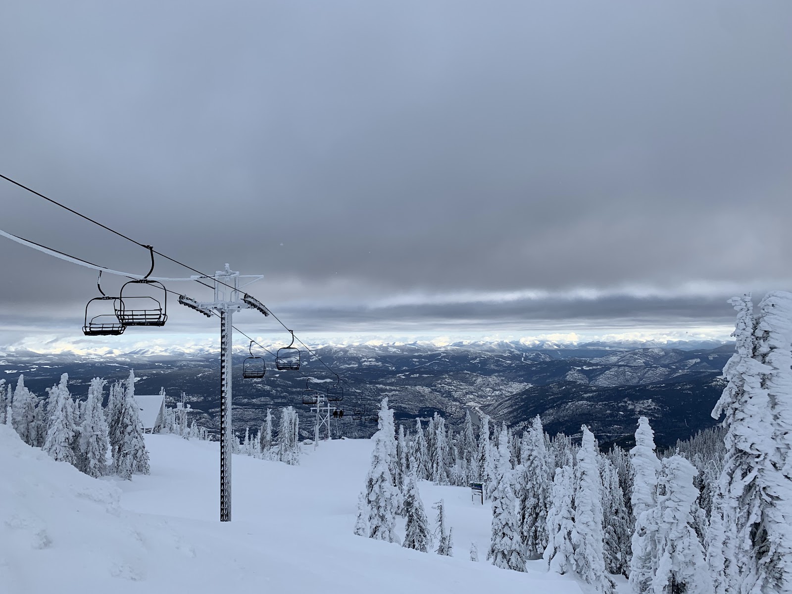Snow covered peaks and tree skiing terrain at Red Mountain Resort near Rossland British Columbia