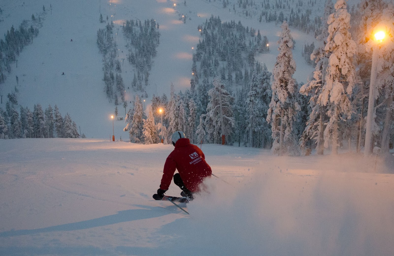 Gentle floodlit ski slope at Saariselka during the Lapland polar twilight