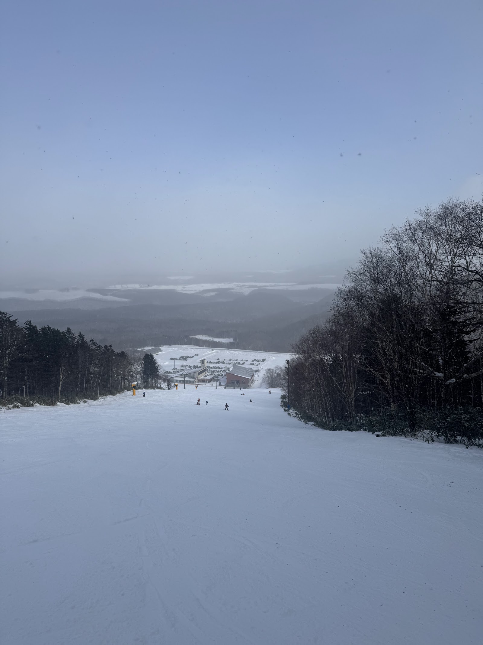 Quiet groomed pistes at Sahoro with central Hokkaido peaks beyond