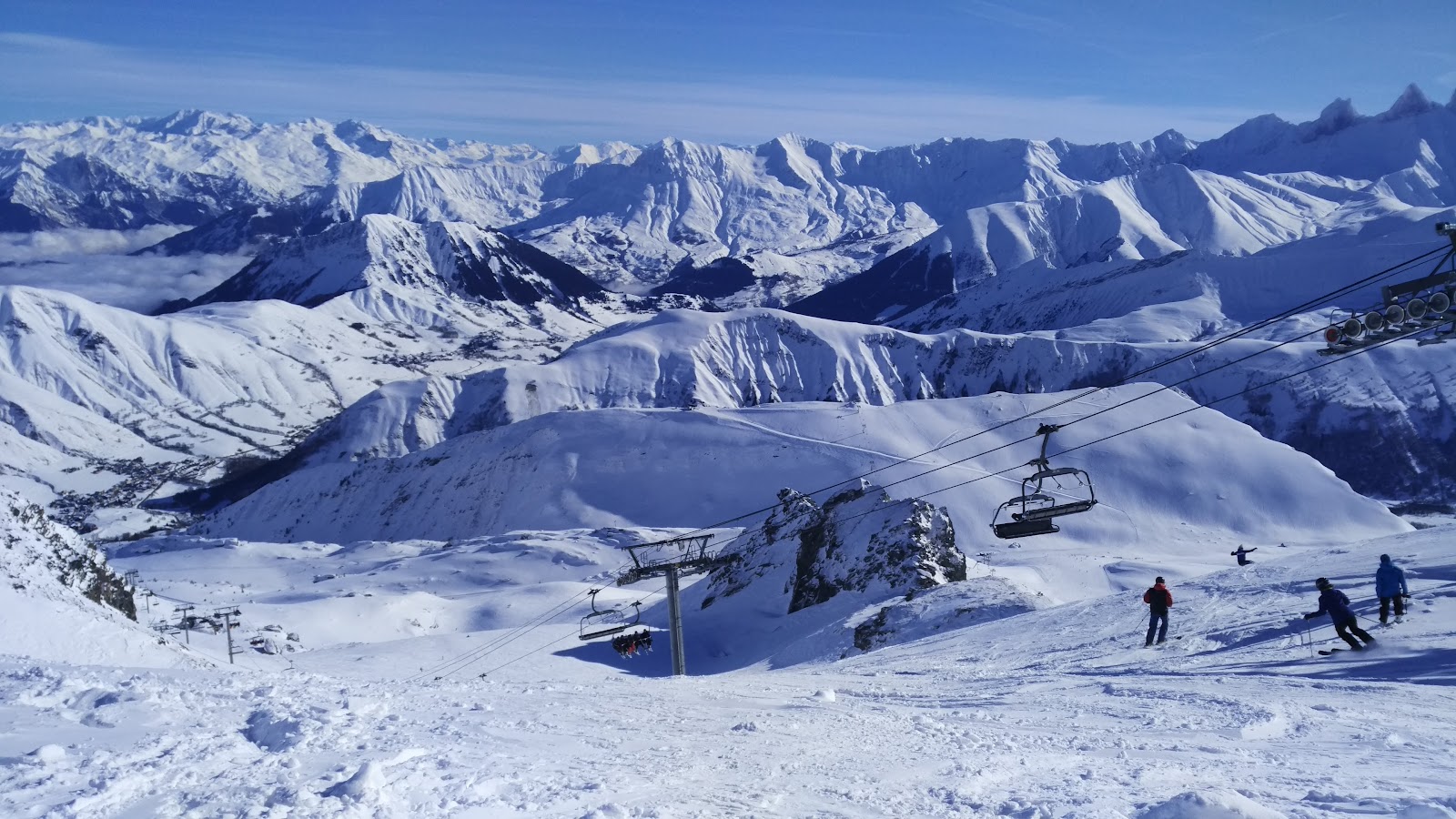 The traditional village of Saint Sorlin d Arves under snow with its stone church