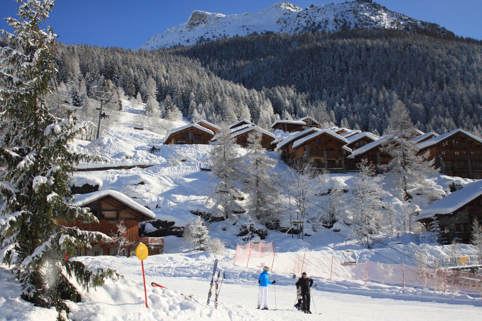 Tree lined off piste descent at Sainte Foy in soft light