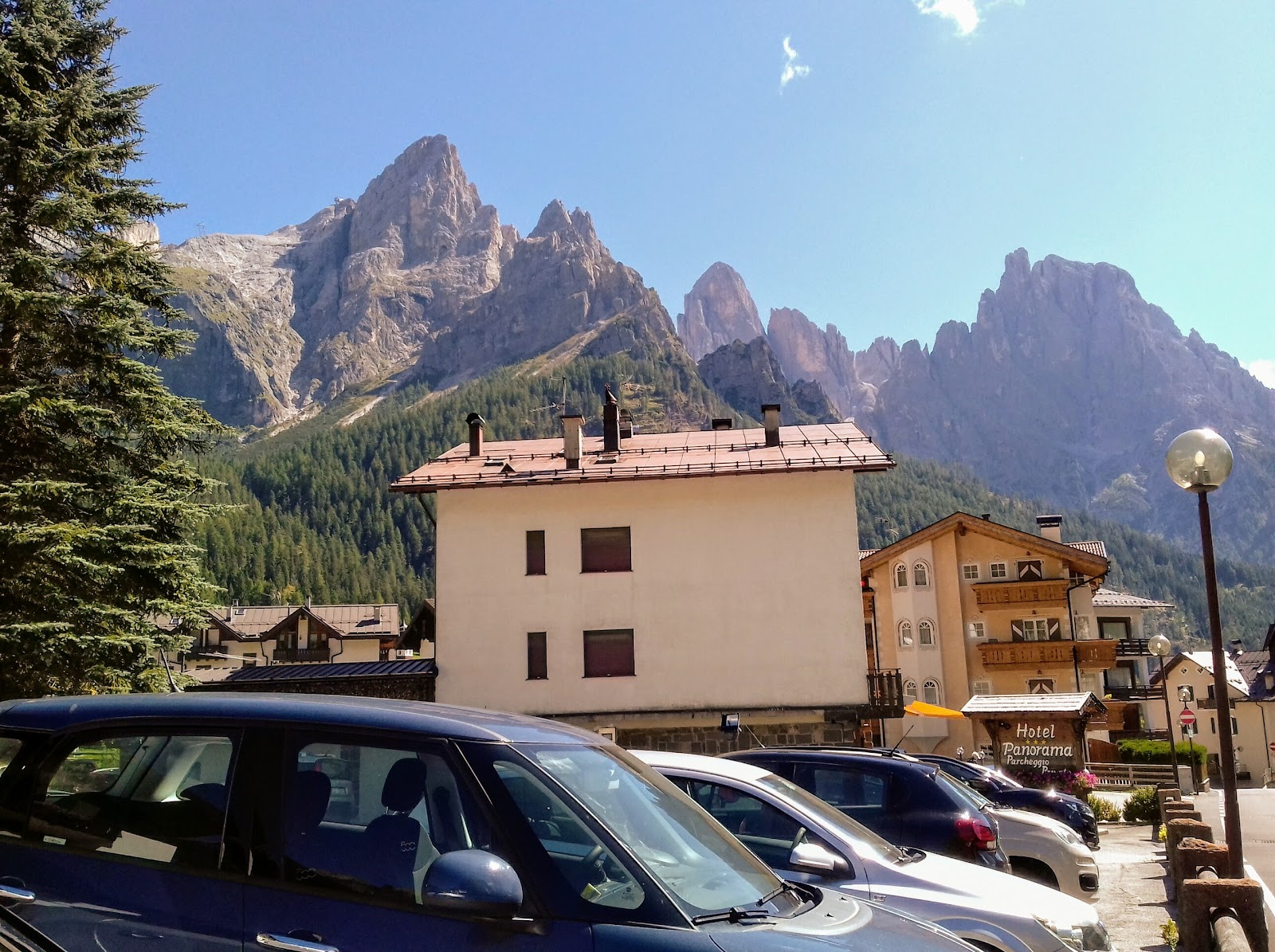Snow covered town of San Martino di Castrozza ringed by peaks