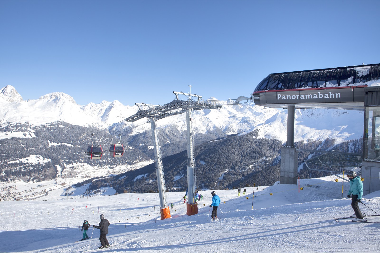 Savognin village in the sunny Surses valley under snow