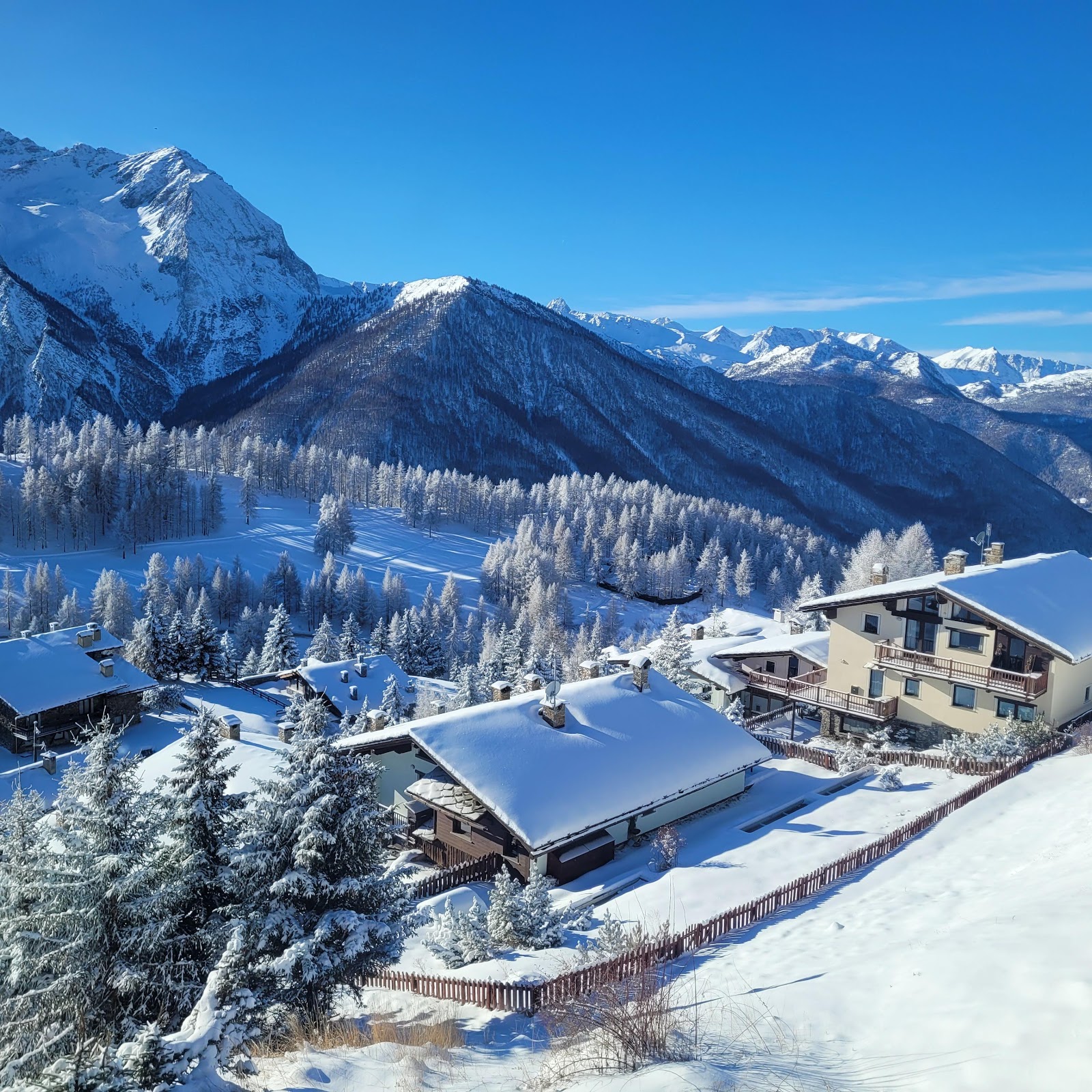Chairlifts and linked slopes of the Via Lattea ski area above Sestriere