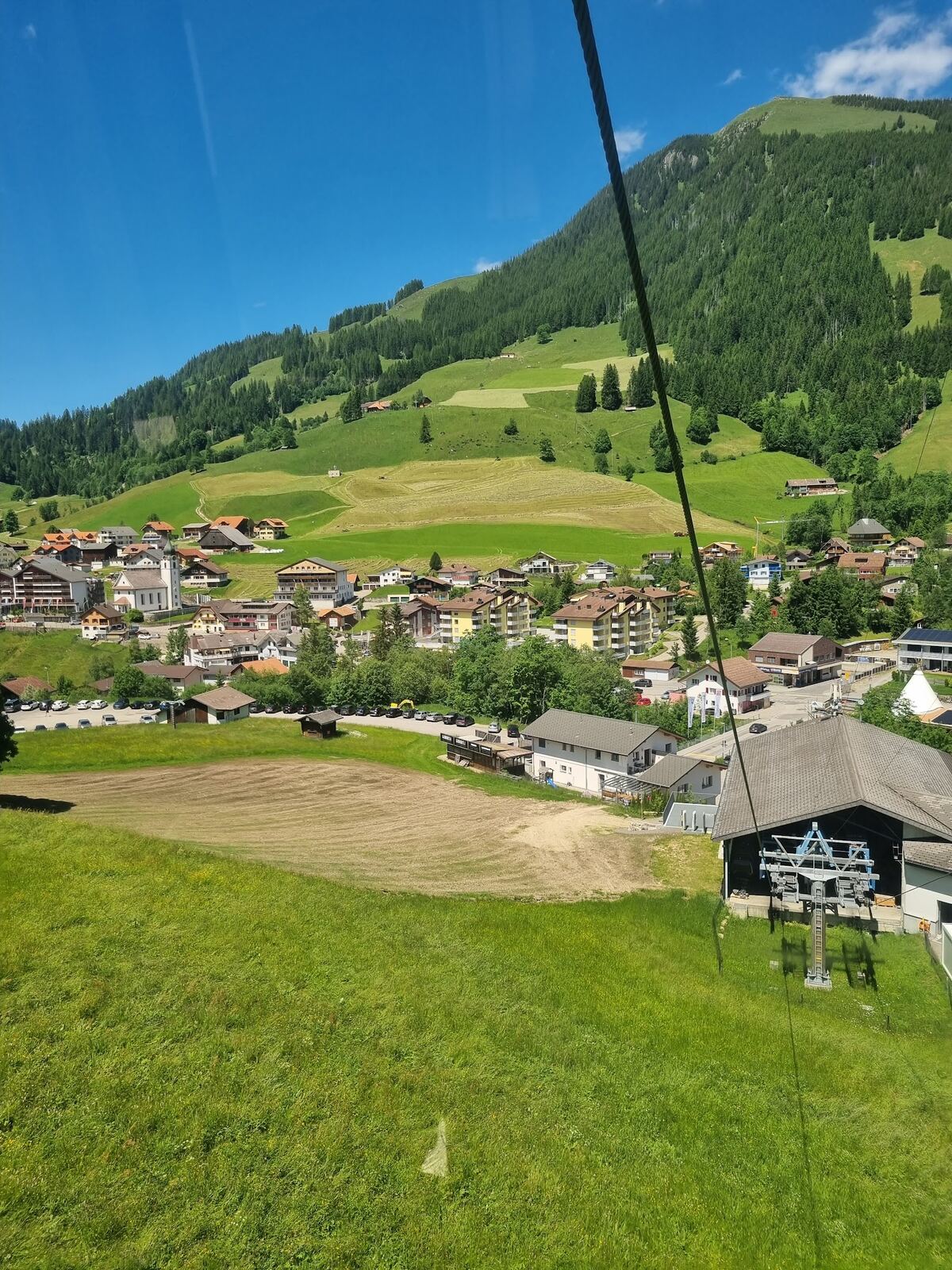 Snowy meadows and farmhouses around Sorenberg in the Entlebuch