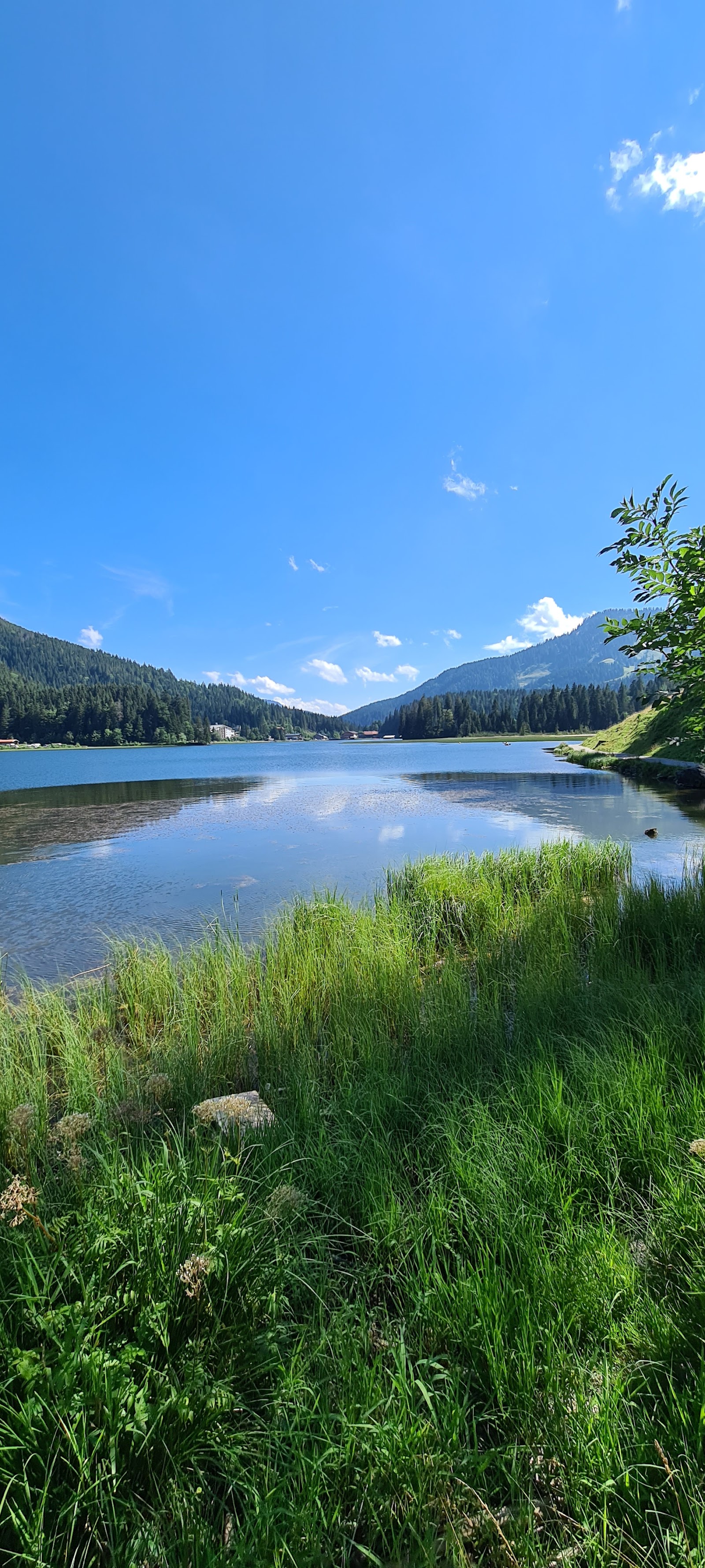 The frozen alpine lake at Spitzingsee surrounded by snowy hills