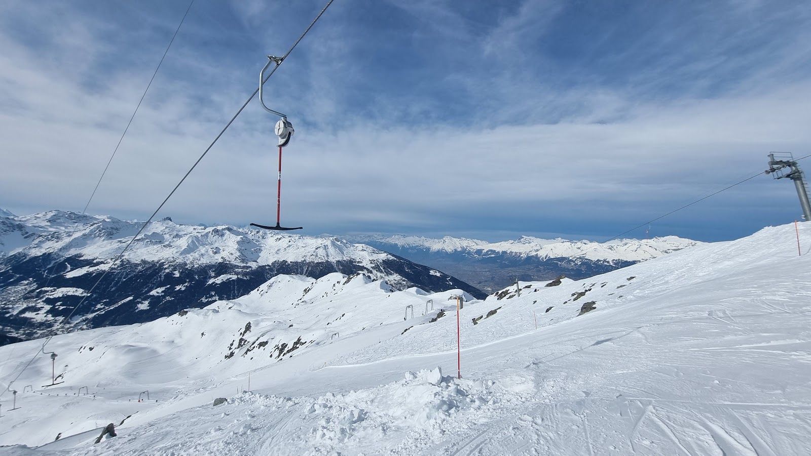 Sunny pistes and big Valais views above St Luc and Chandolin