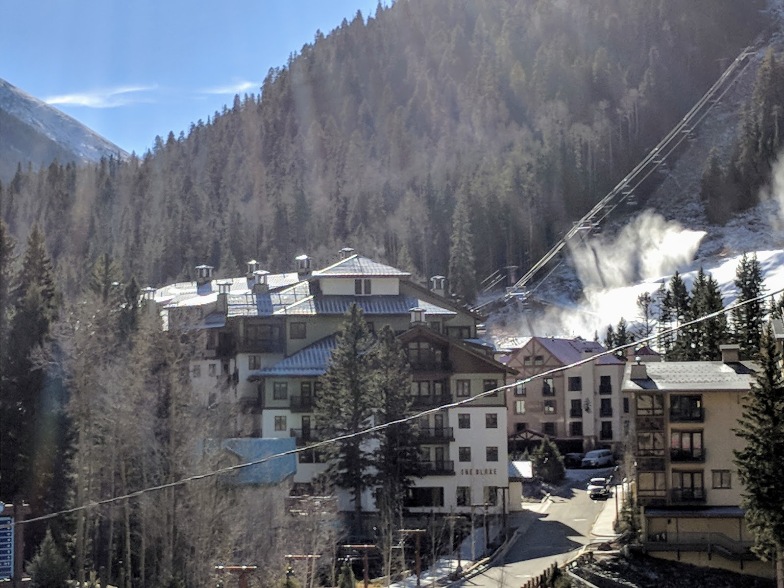Steep Rocky Mountain ski terrain under deep dry powder snow
