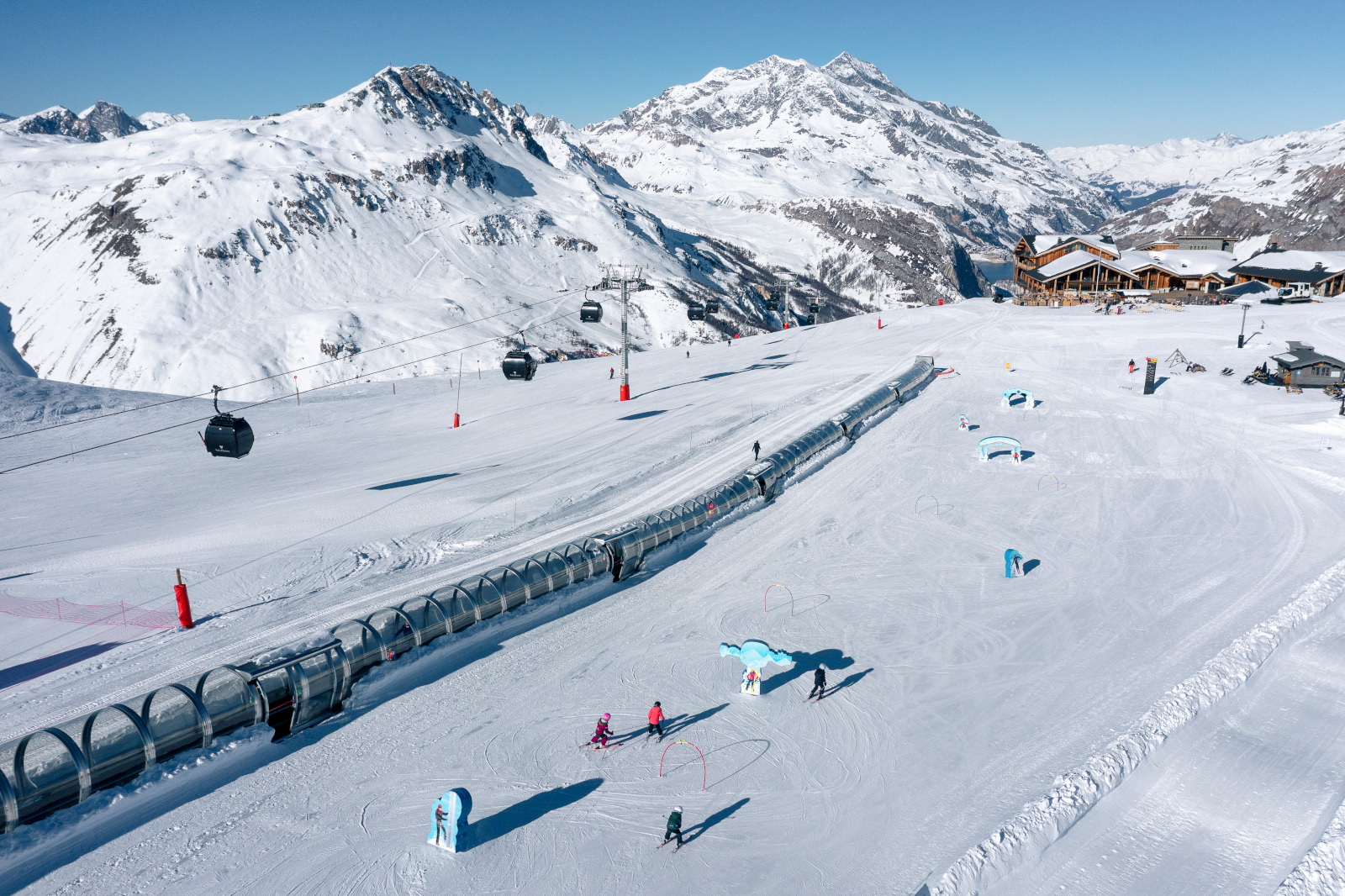 A traditional stone and timber French alpine village under snow