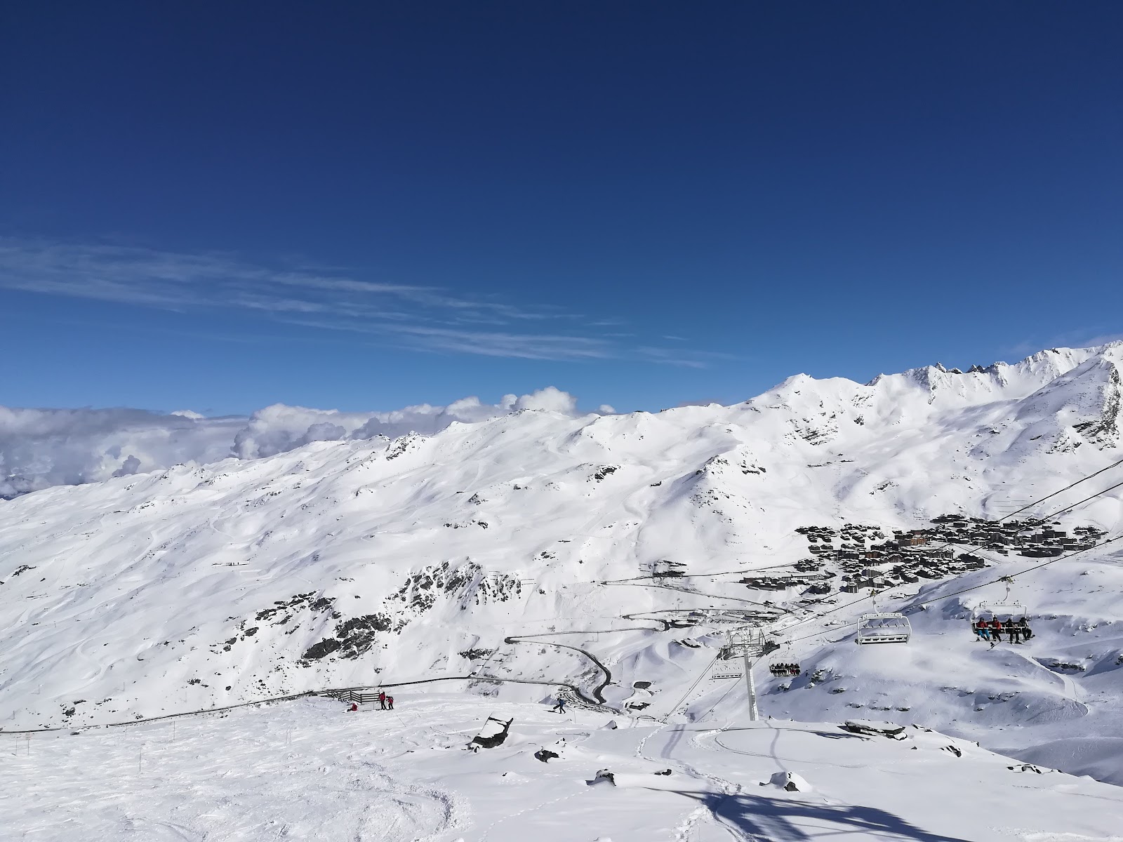 Apartment chalets lining a snowy run in Val Thorens