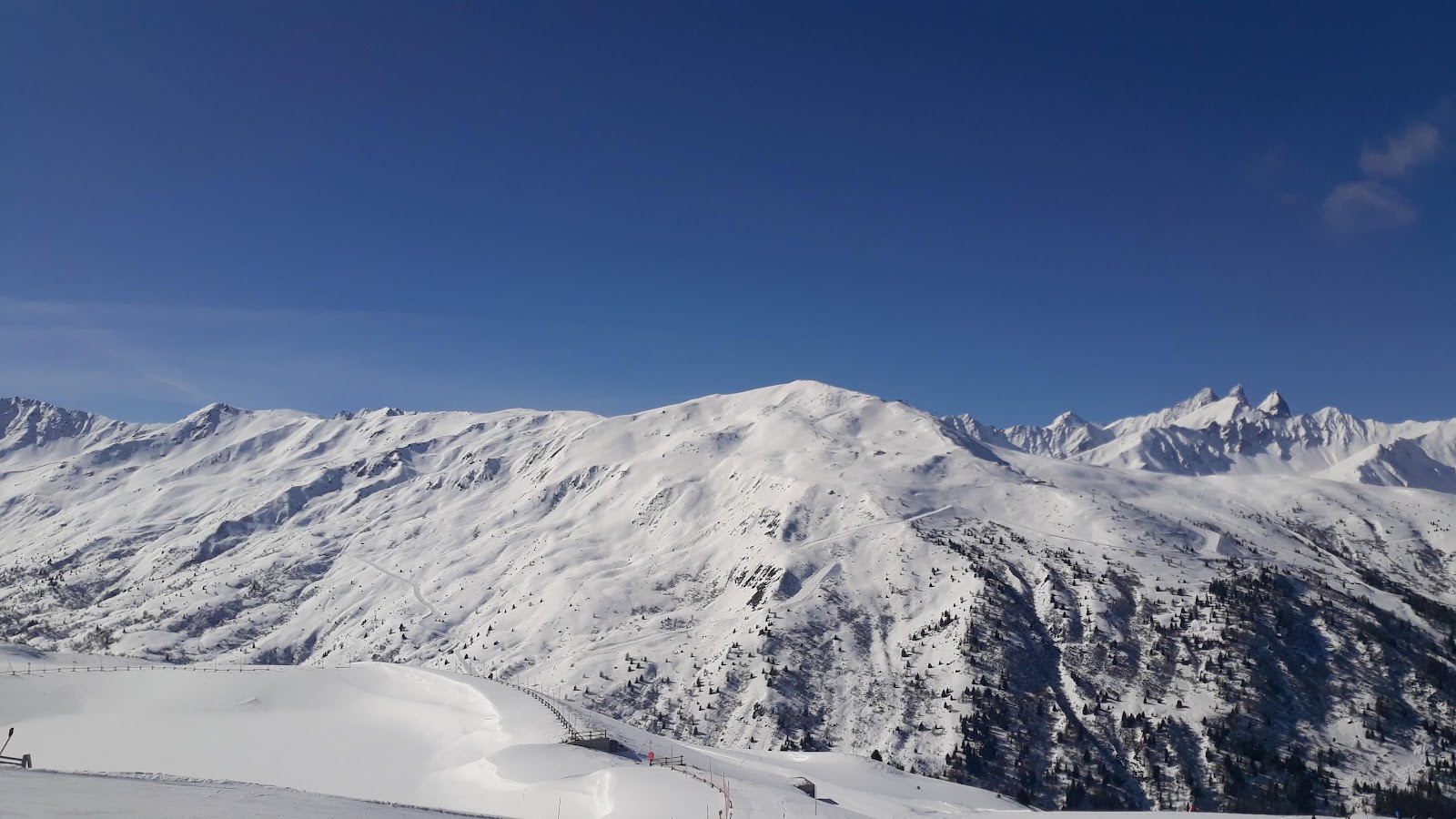 A sunny groomed piste above Valloire in the Maurienne