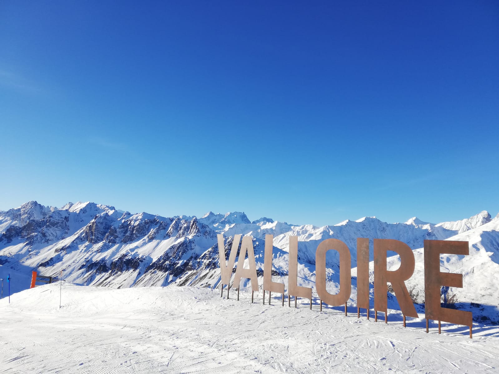 Skiers cruising the Galibier Thabor slopes