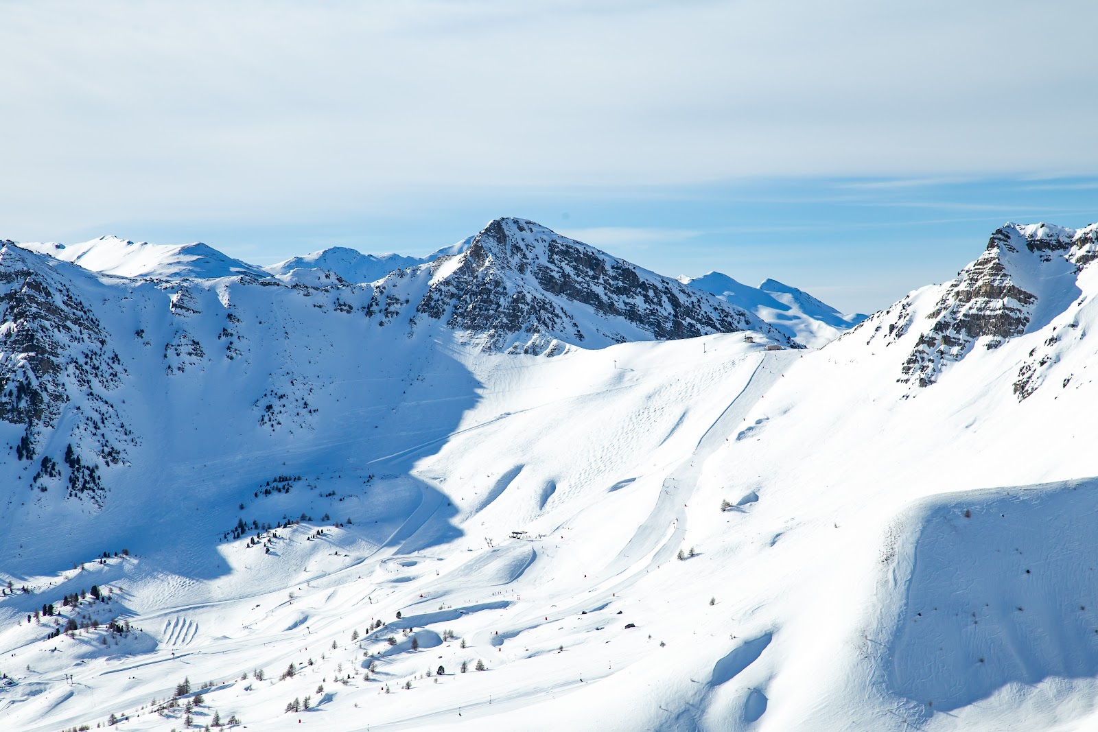 Sunny larch lined pistes of the Foret Blanche ski area above Vars