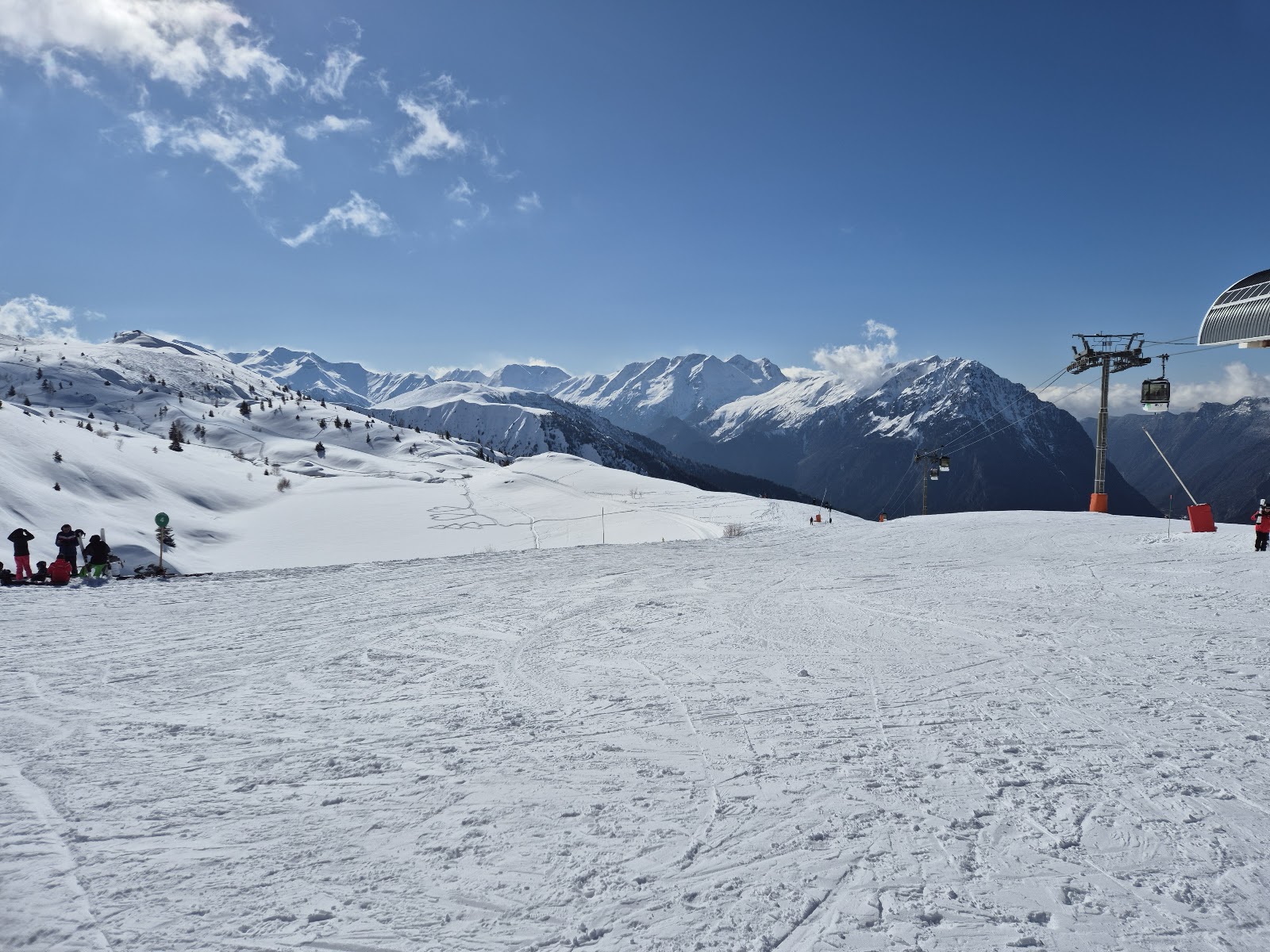 Stone village of Vaujany on a steep hillside under winter snow