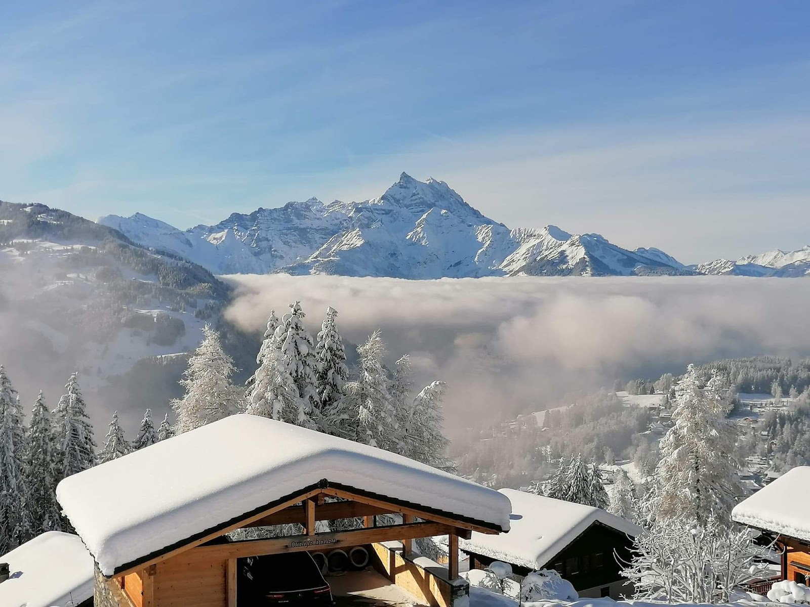 A sunny groomed piste above Villars toward the Rhone valley