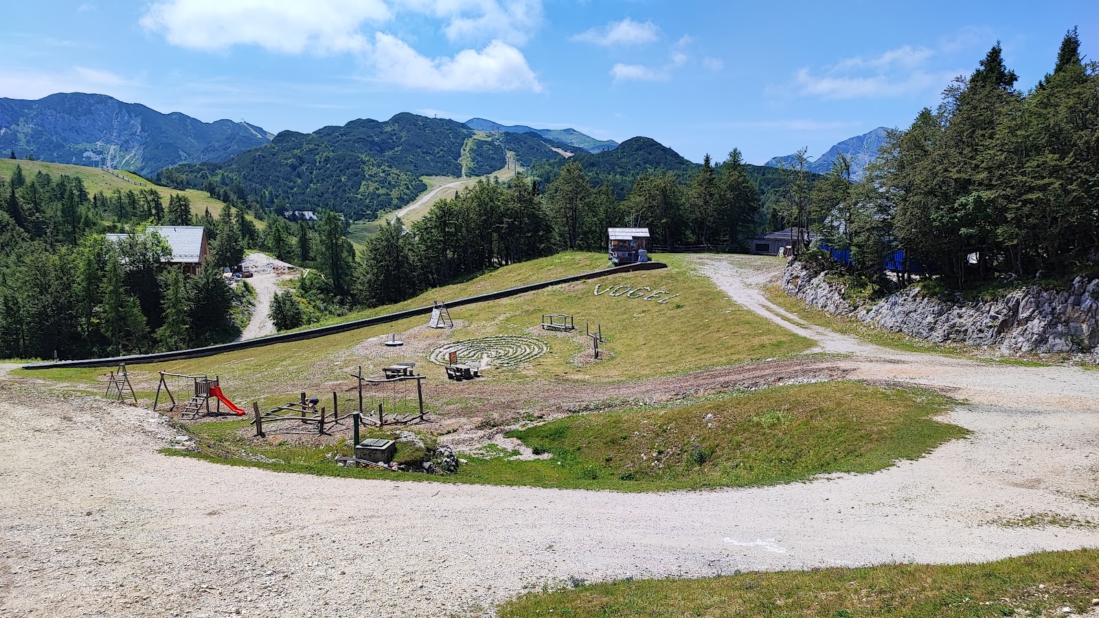 Snowy pistes high above Lake Bohinj with the Julian Alps behind at Vogel in Slovenia