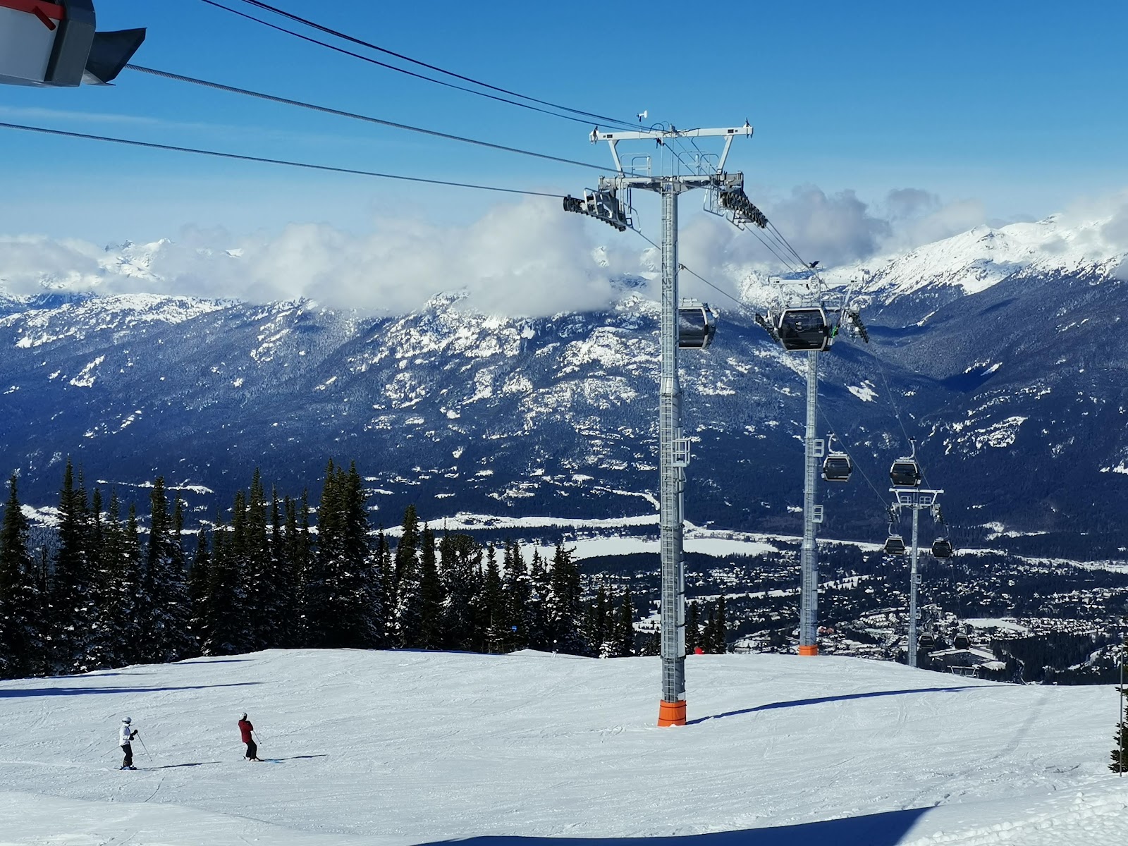 Groomed tree lined runs descending toward the Whistler valley