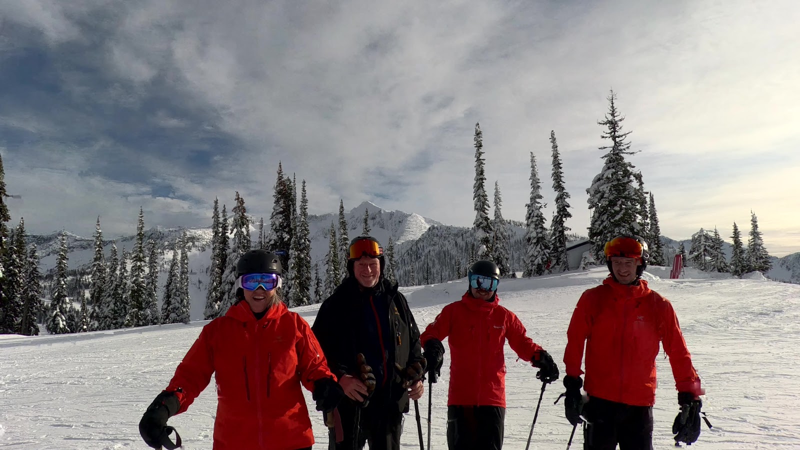 Snowy chairlift and base lodge surrounded by forest at Whitewater