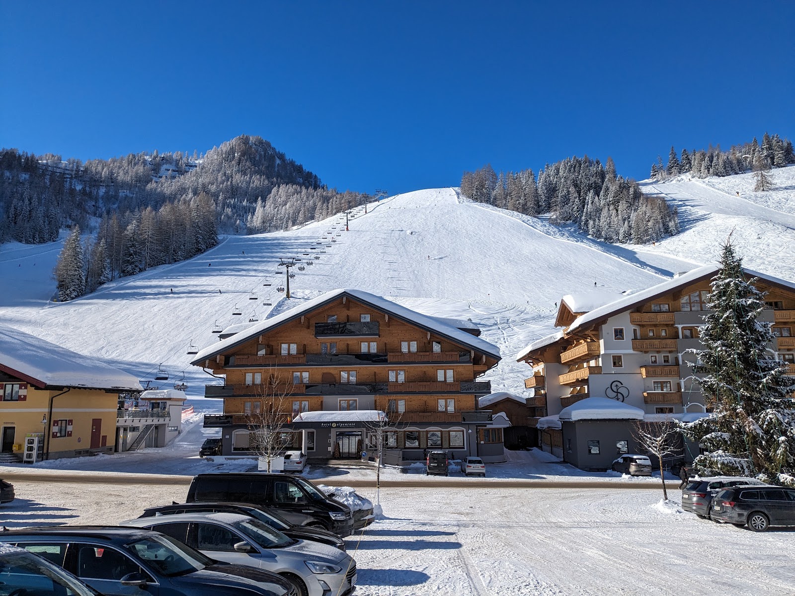 The snowy high basin of Zauchensee with ski in ski out hotels under deep snow