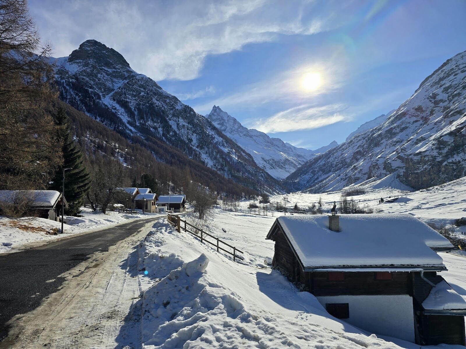 Skiers in fresh snow on the slopes above Zinal