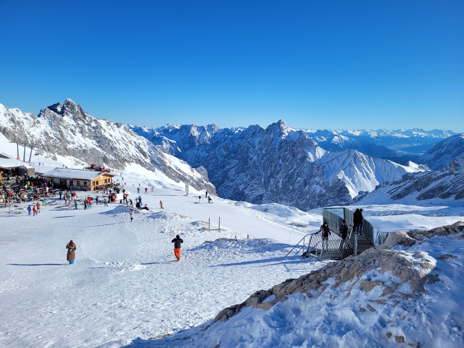The snow covered Zugspitze glacier plateau under a blue sky