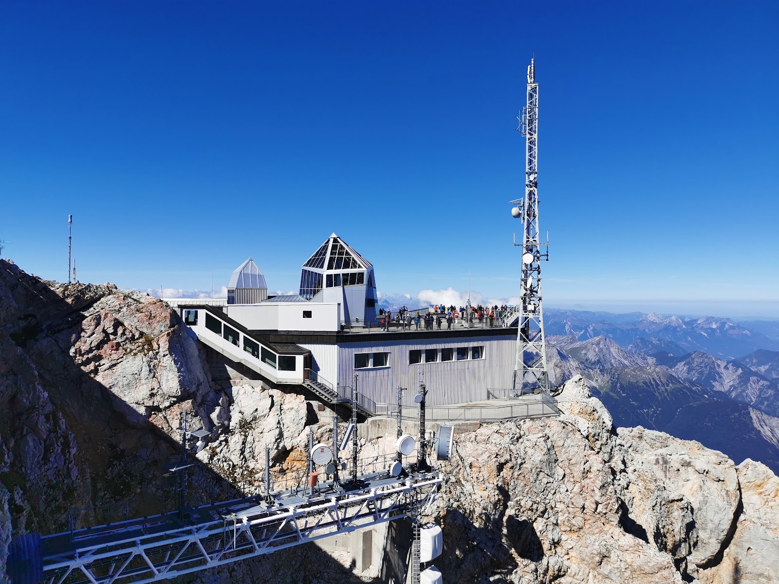 Summit cross and viewing terrace high above the clouds