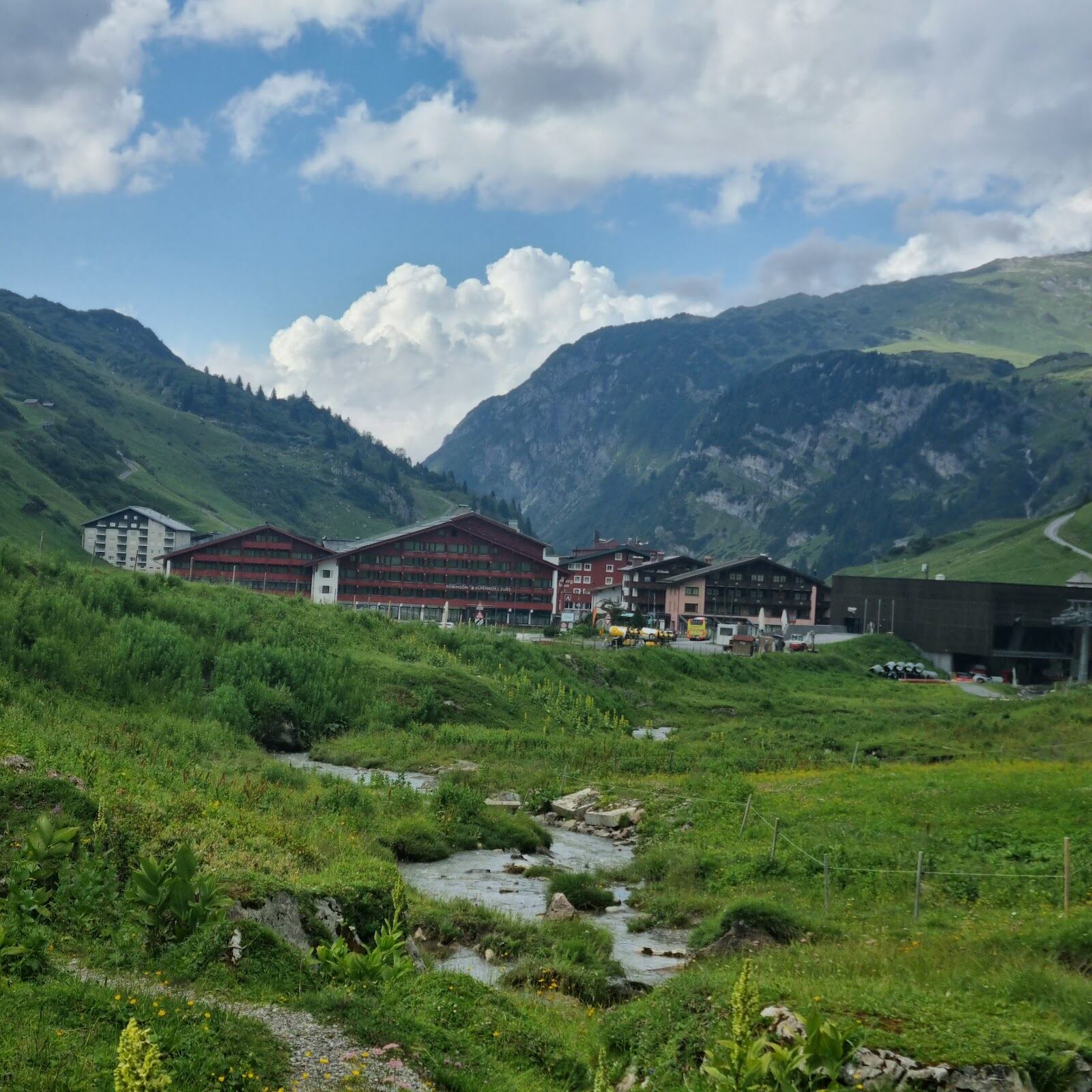 Skiers on open treeless slopes above Zurs